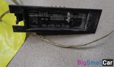 Фонарь подсветки номера от Opel Astra H 2004-2014